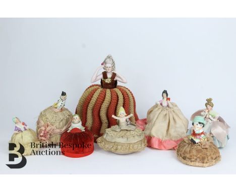 Eight porcelain miniature dolls, four modelled as Victorian ladies, two clowns, two toddlers, two miniature jointed bisque do