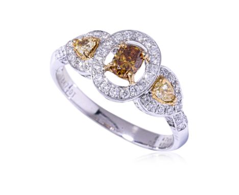 A MULTI COLOURED DIAMOND RING
Featuring an oval 'cognac' diamond weighing approximately 0.40 Cts (marked), mounted in a white
