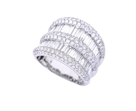 A LARGE BAGUETTE AND ROUND DIAMOND RING Featuring baguette and round brilliant cut diamonds totalling approximately 4.50 Cts,