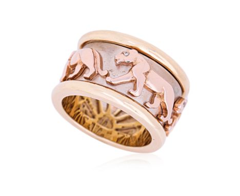 A TRI COLOUR GOLD 'ROTATING PANTHER' RING Featuring five rose gold panthers with diamond eyes on a white gold band, mounted o
