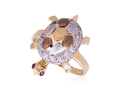 A RUBY AND DIAMOND NOVELTY 'TORTOISE' RING The tortoise with ruby set eyes, the body with a surround of round brilliant cut d