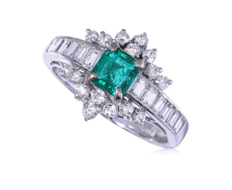 AN EMERALD AND DIAMOND RING
The square cut emerald, approximately 0.70cts (marked), within a surround of round brilliant and 