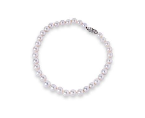 A CULTURED PEARL STRAND WITH A DIAMOND CLASP Featuring cultured pearls measuring 10-12.5mm, on an unmarked white gold clasp a
