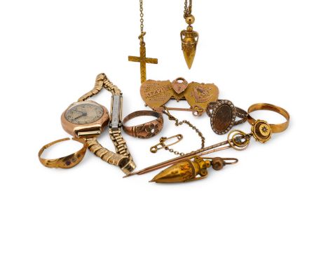 A group of jewels, comprising: a late 19th century 'Mizpah' brooch, stamped 9CT; a 9ct gold ring, British hallmark; a ruby an