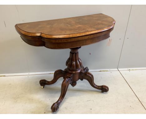 A Victoria figured walnut folding card table, width 91cm, depth 45cm, height 76cm. Condition - fair