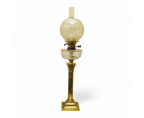 An Edwardian brass Corinthian columned oil lamp, 77cm high including funnel and shade. Condition - column good glass bowl, br