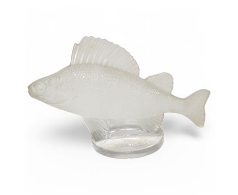 A modern Lalique glass paperweight in the form of a fish, signed to the base, 16cm wide. Condition - good