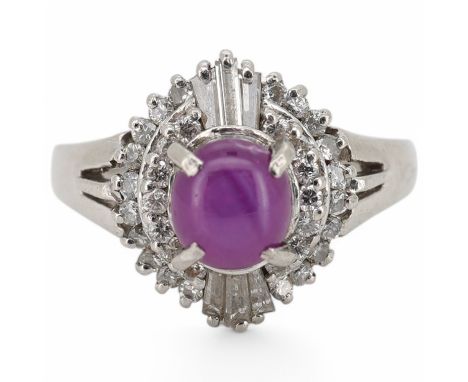 A modern platinum, star ruby and diamond cluster set dress ring, size J/K, gross weight 4.7 grams. Condition - fair to good