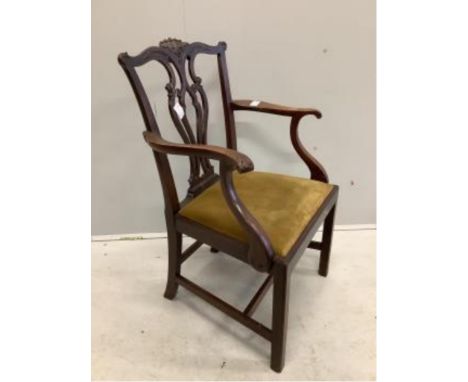 Four Chippendale style mahogany dining chairs, with pierced, interlaced splats above old gold velour drop in seats, one with 