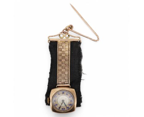 A lady's 9ct gold manual wind lapel watch, with blue enamelled Arabic dial and a 9ct mounted black sash suspension brooch, gr