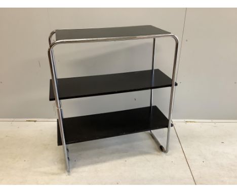 A mid century black lacquer and chrome three tier shelf unit, width 93cm, depth 38cm, height 107cm. Condition - poor to fair