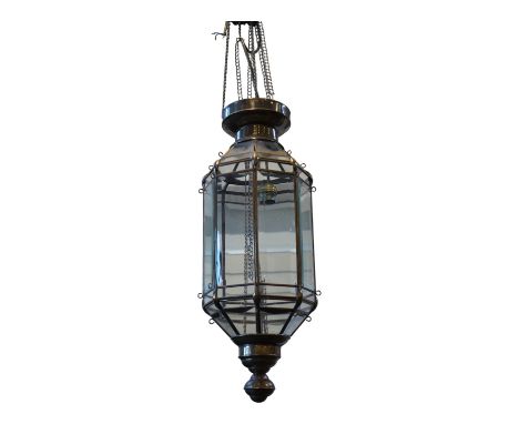 A Moroccan hanging brass and eight panelled glass lantern, 60cm long. Condition - good
