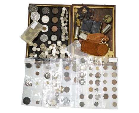 A collection of silver coins mounted as jewellery, pierced coins, commemorative medals, tokens and various coin wallets and s