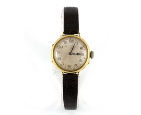 A vintage 18ct yellow gold watch with leather strap.