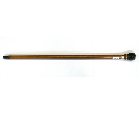 A unusual dogs head dice shaker handle walking stick, handle L. 5cm. Overall L. 78cm.
