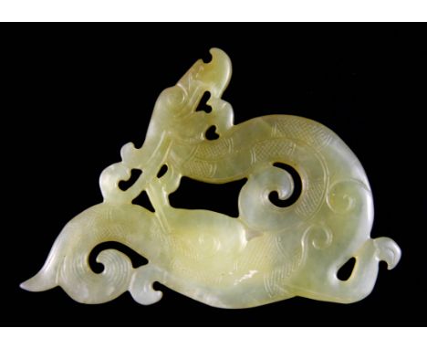 A Chinese carved celadon nephrite jade figure of a dragon, W. 14.5cm.