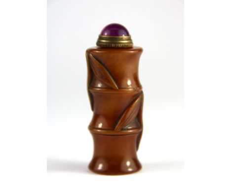 A Chinese carved soapstone snuff bottle in the form of a stem of bamboo with an engraved seal base, H. 7cm.