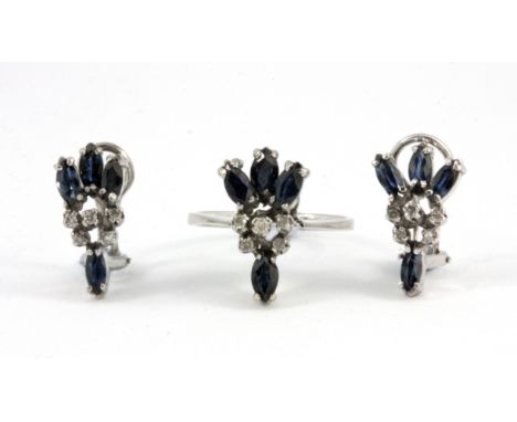 A pair of white metal (tested silver) earrings set with sapphires and diamonds, together with a matching ring, (N.5).