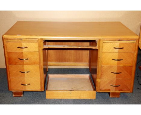 A vintage golden oak desk with nine drawers, 151 x 83cm.