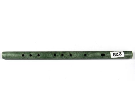 A carved jade flute, L. 37.5cm.