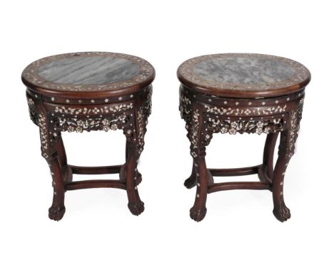 A Pair of Late 19th/Early 20th Century Chinese Hardwood and Mother-of-Pearl Inlaid Plant Stands, of oval form with grey and w