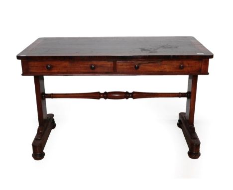 A Victorian Rosewood Pillar End Writing Table, mid 19th century, with a gilded red leather writing surface above two frieze d