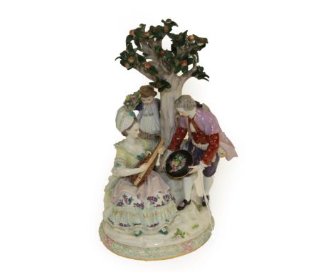 A Meissen Porcelain Figure Group, late 19th century, as a lady sitting playing the guitar, a gentleman offering a hat of flow