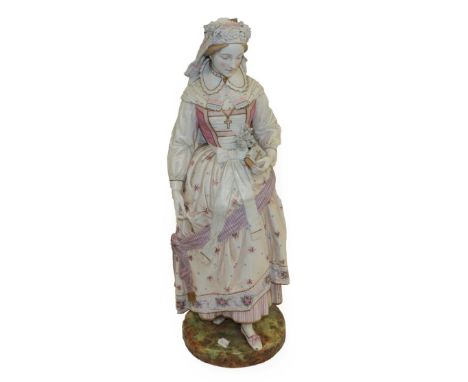 A Vion &amp; Baury Bisque Porcelain Figure of a Maiden, late 19th century, dressed in Renaissance style, holding a bible, lil