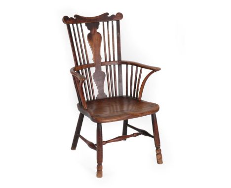 A Late 18th Century Thames Valley Fruitwood Armchair, the comb shaped top rail above a solid vasiform splat and elm moulded s