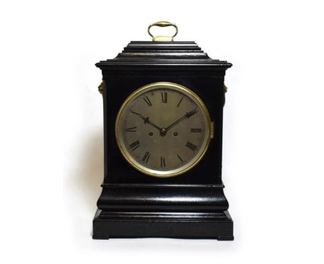 An Ebonised Striking Table Clock, circa 1850, inverted bell top with carrying handle, ringed lion head side handles and glaze