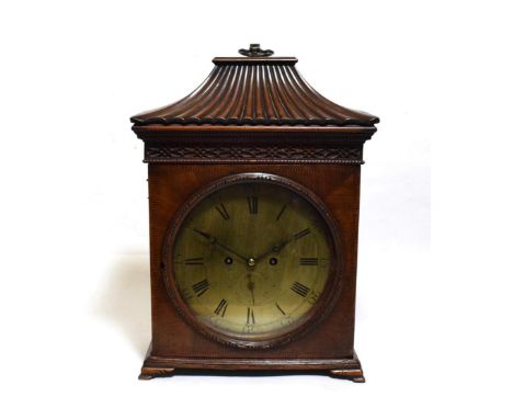 ~ A Mahogany Striking Table Clock, 19th century, pagoda pediment with carrying handle, pierced side frets, 9-1/2-inch circula