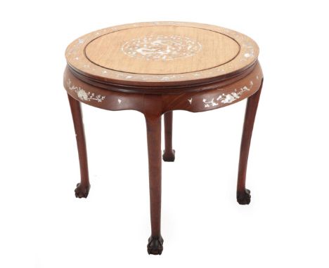 An Early 20th Century Chinese Hardwood and Mother-of-Pearl Inlaid Centre Table, the moulded top decorated with a foliate and 