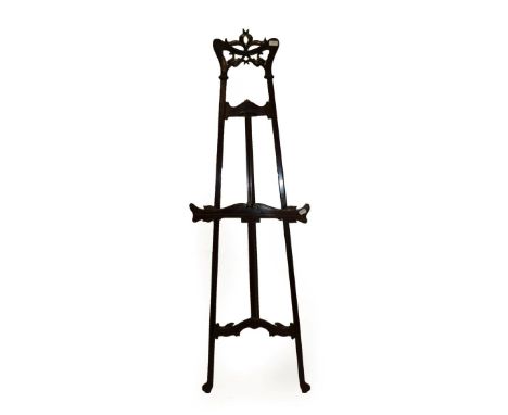 An Art Nouveau Mahogany Adjustable Easel Stand, circa 1900, with stylised frame and rise-and-fall support secured by a lockin