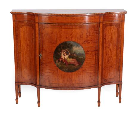 An Edwardian Satinwood, Crossbanded and Ebony Strung Cabinet, the bowfront cupboard door painted with a circular panel after 