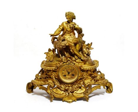 An Ormolu Striking Mantel Clock, circa 1890, surmounted by a seated gentleman beside his dog carrying a basket of roses in it