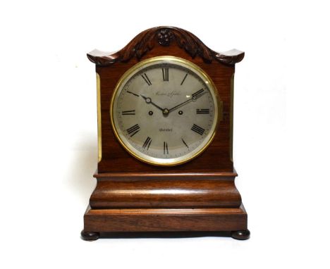 A Rosewood Striking Table Clock, signed Muston and Gath, Bristol, circa 1840, arched pediment, pierced side frets, 7-1/2-inch