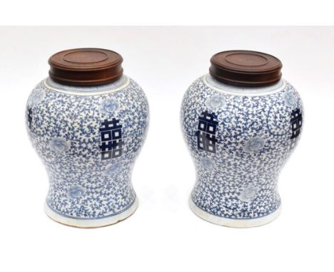 A Pair of Chinese Porcelain Baluster Jars, 19th century, painted in in underglaze blue with Shou characters on a lotus scroll