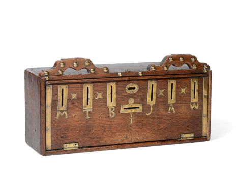 A Brass Mounted Oak Money Box, dated 1848, of rectangular form with two carrying handles, the fall front with seven slots ini