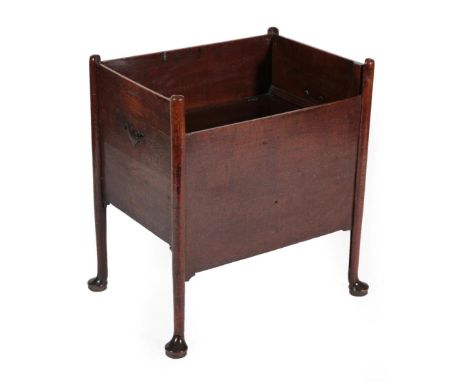 ^ A George III Oak Bedside Commode, late 18th century, with a rise-and-fall front panel enclosing a hinged seat and ceramic l