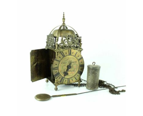 An early 20th century brass lantern clock, by Thos. Moore, Ipswich, with weight and pendulum. CONDITION REPORT Please note th