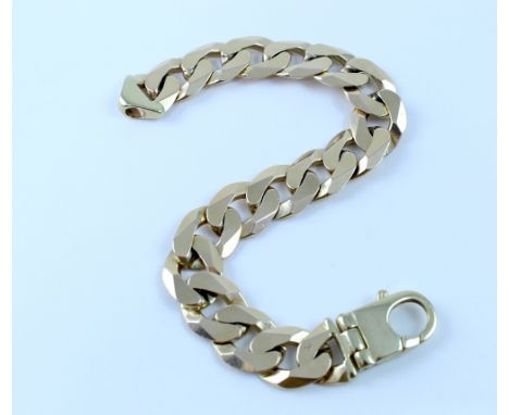 A 9ct gold heavy flat curb bracelet, length approx 23cm, approx 65.8g. CONDITION REPORT Approx width of curb is 1.5cm. In gen