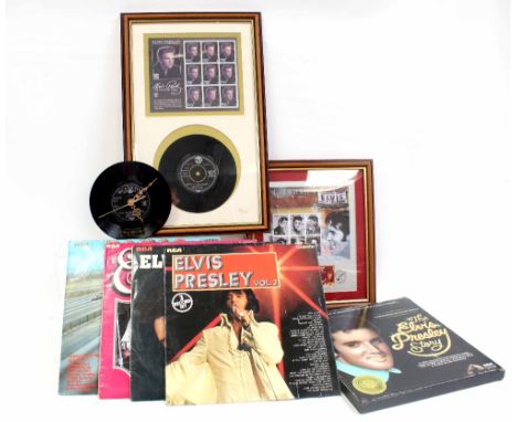 A quantity of Elvis Presley memorabilia to include a wall clock mounted on an Elvis 'Devil in Disguise' 45rpm, 'The Elvis Pre