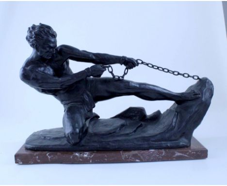 A late 19th/early 20th century Continental School patinated spelter figure depicting a male in loincloth breaking his chains,