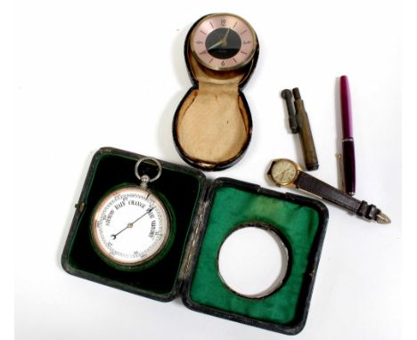 A pocket barometer in silver and leather travel case, the case by Henry Matthews, Birmingham 1904, also a travel alarm clock 