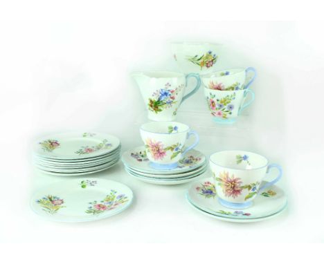 A Shelley 'Wild Flowers' Henley shape part tea service comprising four cups, five saucers, side plates, milk jug and sugar bo