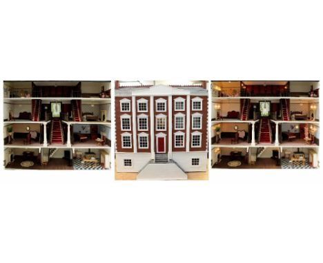 A well presented large double-fronted dolls' house with kitchen, bathroom, nursery, etc and grand staircase to centre, contai