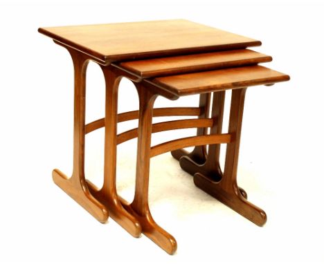 A G-Plan teak nest of three tables. CONDITION REPORT Signs of light use throughout. The middle table has several scratches ru