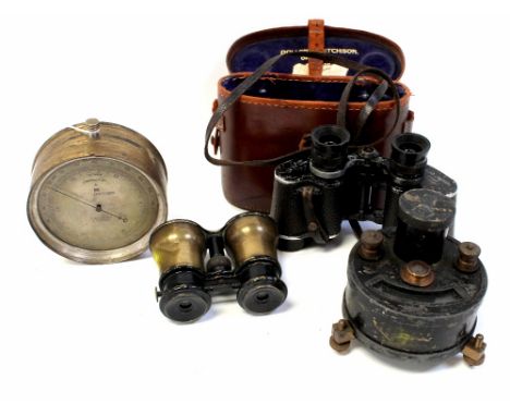 A pair of brass binoculars, triple adjustable front lens 'Theatre', 'Field' and 'Marine', with adjusting knob, a pair of Doll