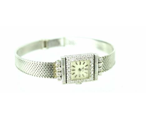 A ladies' Vertex platinum and diamond-set bracelet watch, the square silvered dial set with raised silvered batons and hands 
