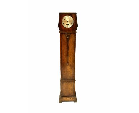 An Art Deco oak eight-day grandmother clock, the silvered dial set with Arabic numerals, chime mechanism, in a carved case wi